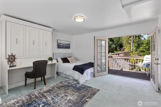 Primary bedroom/loft facing private deck with French doors.
