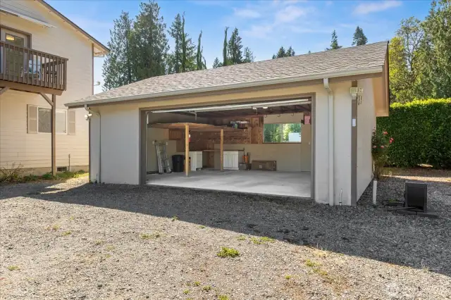 Oversized detached garage with storage loft and shop area.
