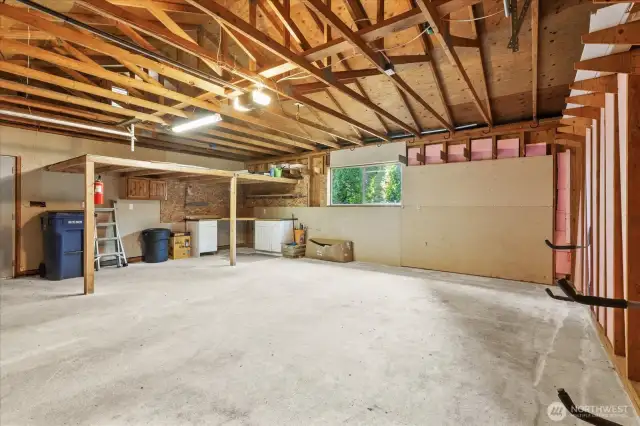 Oversized detached garage with storage loft and shop area.