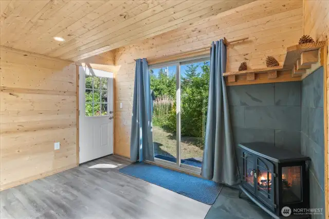 Lower level of bunkhouse with electric fireplace.