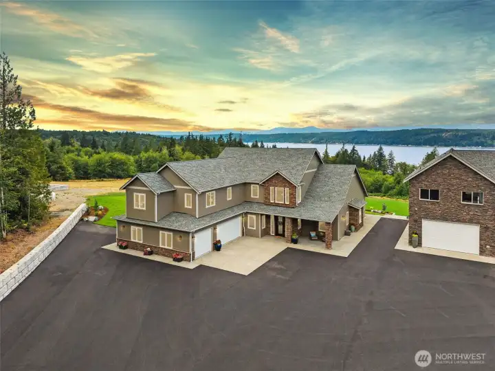 Welcome to Belfair! 5 Acre estate w/ 3 distinct structures - main home, guest home & garage + additional shop.