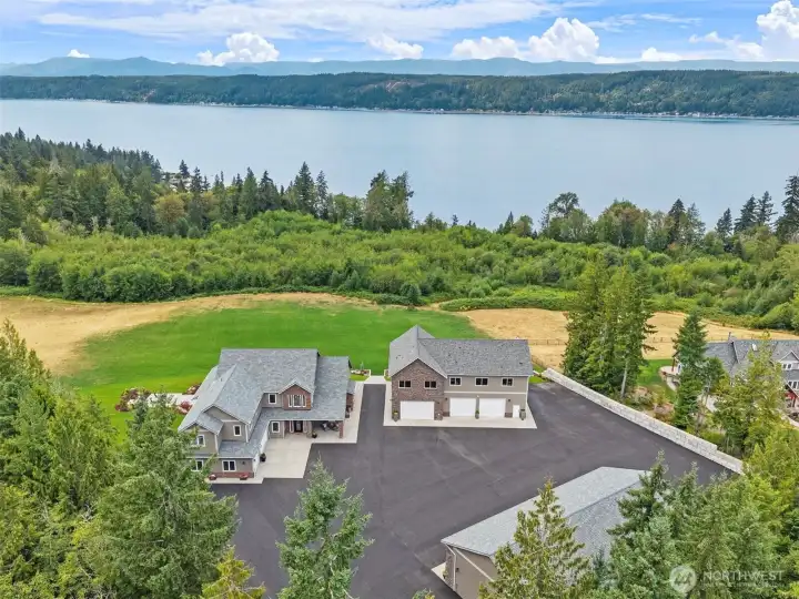 5 Acre estate w/ 3 distinct structures - main home, guest home & garage + additional shop.