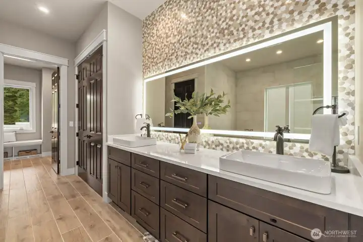 Main floor primary suite  5 piece bath w/ Pental Stella Claudis Quartz Countertops, Soaking Tub, Dual-Shower Heads, Double Vanity, Towel Warmer & "Closet by Design" Walk-in Closet. All Bathrooms w/ Amorho LED Lighting Mirrors.