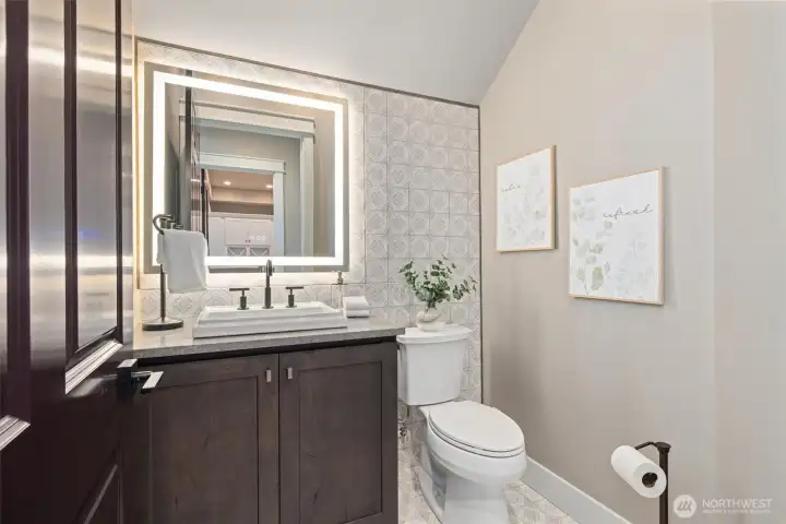 Main floor powder bath. All Bathrooms w/ Amorho LED Lighting Mirrors.