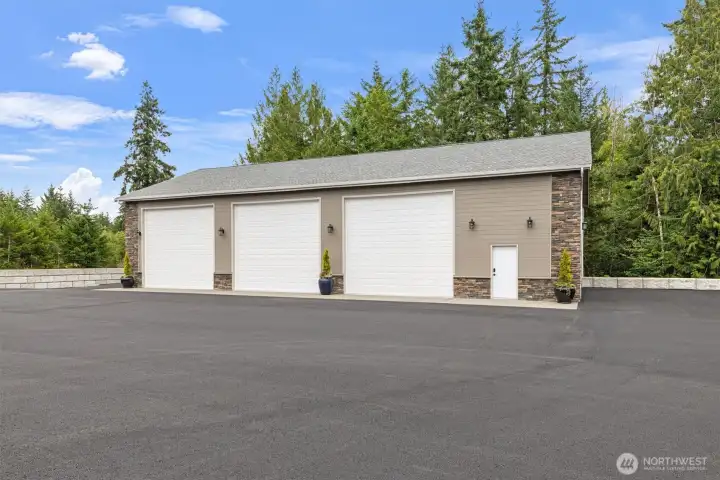 3,000 SF detached shop. Insulated w/ heat, A/C & wired for gates.