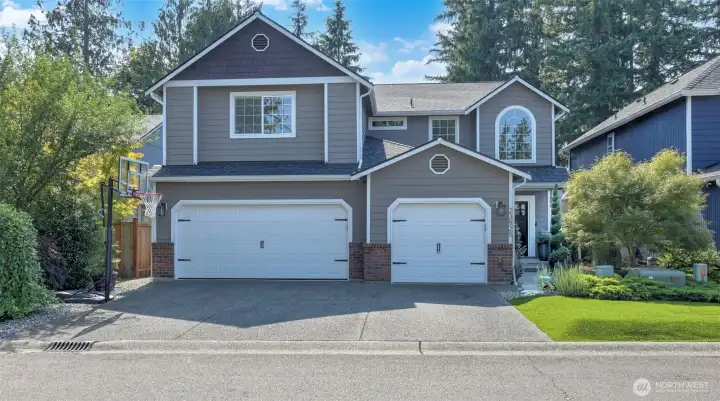 Welcome to this beautiful Maple Valley home in Belmont Court! Featuring soaring ceilings, abundant natural light & an open layout. The kitchen offers ample cabinetry & flows seamlessly to dining & living areas w/a cozy gas fireplace. Spacious primary suite boasts a double-sided walk-in closet & spa-inspired ensuite w/dual vanities, soaking tub & separate shower. Outside, the fully fenced yard offers turf in both the front & back for low-maintenance living, a garden space, & a covered patio w/a hot tub that stays—perfect for entertaining or quiet mornings. Enjoy AC for year round comfort! No HOA & conveniently located near parks, schools, shopping & dining. Located in the award winning Tahoma School District - this home has so much to offer!