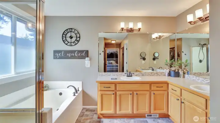 End your day in this luxurious primary 5-piece en suite featuring dual vanities, a soaking tub, and a separate walk-in shower for ultimate comfort and convenience.