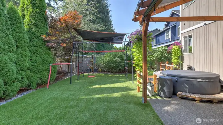 Enjoy low yard maintenance with a turf front and back yard! Play structure stays!