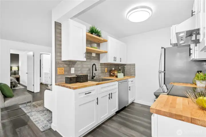 Butcher block counters, new cabinets, new appliances, updated lighting.