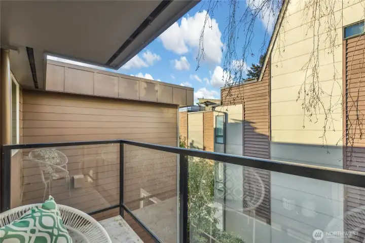 Covered balcony overlooking courtyard