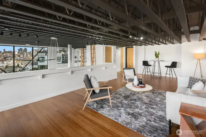 Mezzanine has an elevator to the rooftop deck and set of side stairs