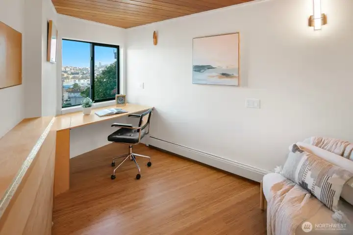 Bonus space with great views for hobbies or home office. Two built in custom desks