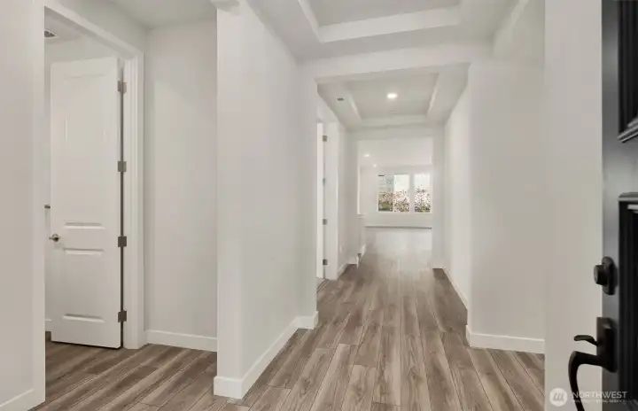 Inviting wide hallway.  Photo of same design, not this specific house.