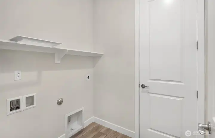 Laundry room with hook ups.