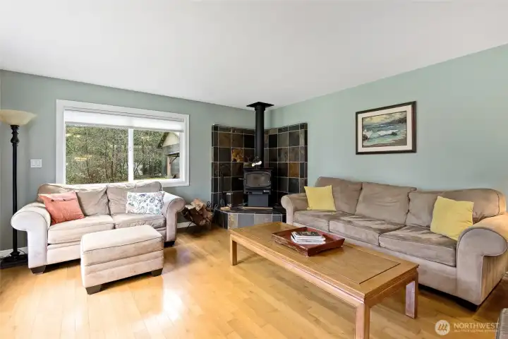 Wood burning fireplace with slate tile surround.