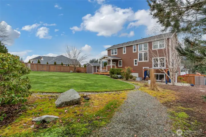 View of Home From Path to RV and Trampoline Pad's