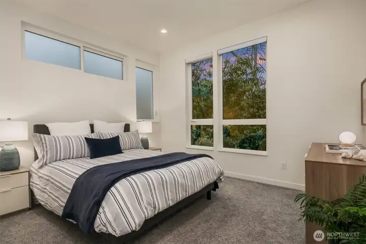 Primary suite with views of the trees.