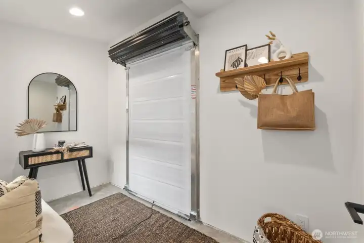 Flex room with garage door. Scooter garage.