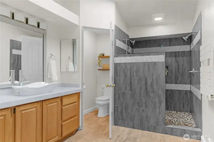 So much light in this beautiful bathroom! Heated towel rack included.