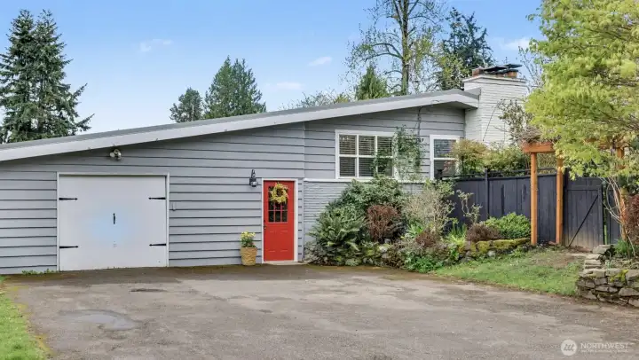 Driveway/garage access with 2nd entrance to the home.