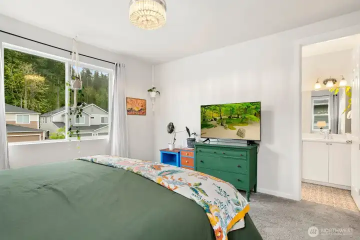 Primary bedroom with attached bathroom. Primary bedroom with attached bathroom.