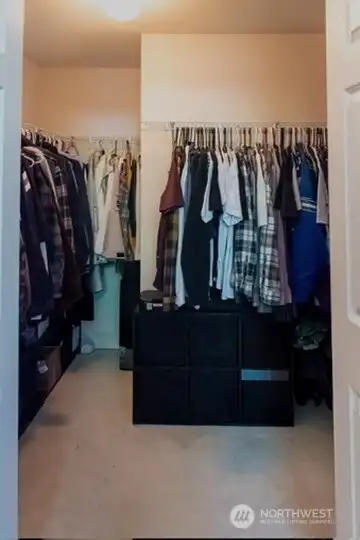Walk-in closet in primary bedroom