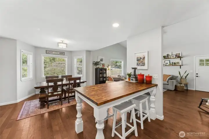 Dining room sits in a bay window overlooking garden Dining room sits in a bay window overlooking garden