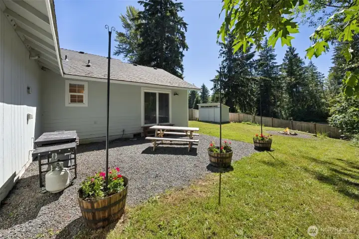 Back yard slider to primary, firepit area just beyond Back yard slider to primary, firepit area just beyond