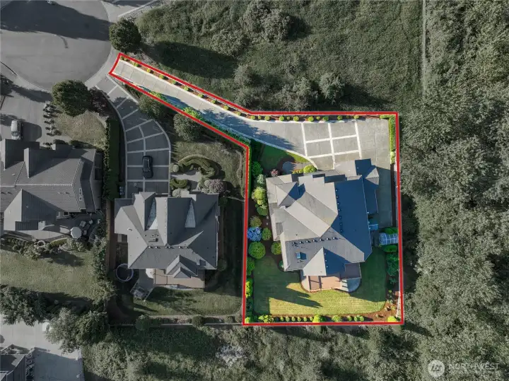 Enjoy excellent privacy and up-close natural views, with woods and open space on three sides. Approximate property lines shown.