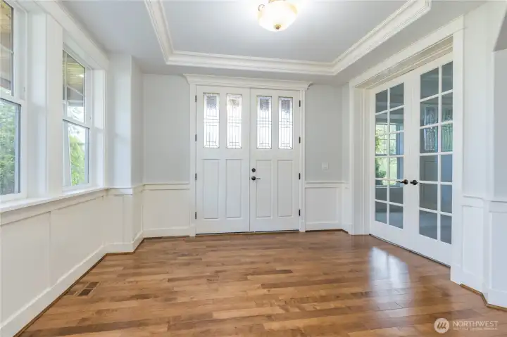 Bright and elegant entrance featuring double doors, a sophisticated tray ceiling, and convenient access to the main floor office. Enjoy fresh interior paint and brand new carpeting throughout the home!