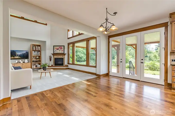 Sun-filled breakfast nook and family room adjacent to the kitchen, creating a seamless, open flow for effortless daily living and easy entertaining.