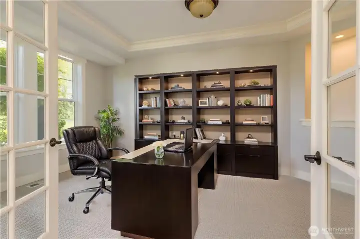 Dedicated main floor office featuring double French door entry and a private, quiet setting.