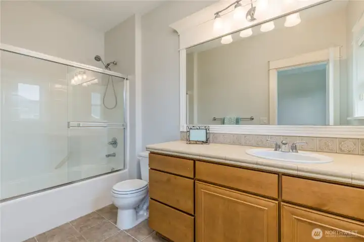Full bathroom serving the secondary bedroom.