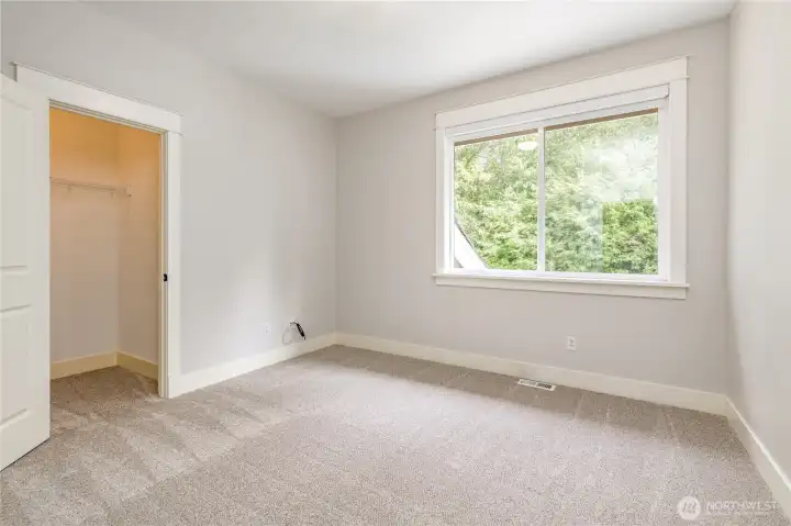 Fourth bedroom includes a spacious walk-in closet.