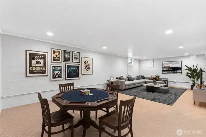 Refinished basement with full bathroom, laundry room, and additional storage