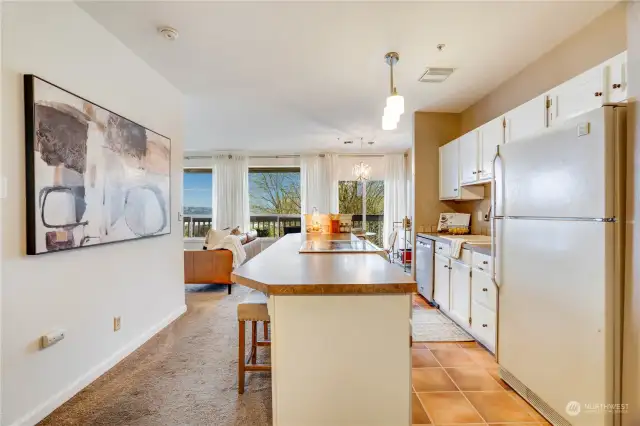 Upon entry, you'll see the oversized (but fitting) kitchen island and big views of the water and Port of Tacoma.