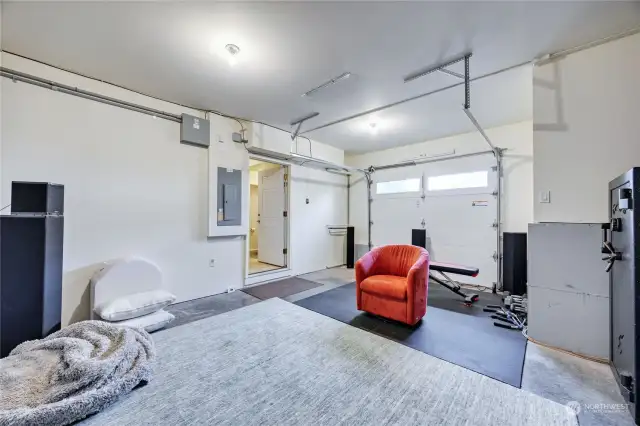 Sellers are currently using one garage bay as a workout/hangout room.