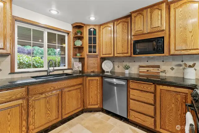 Solid wood cabinets through out the kitchen offer great storage.