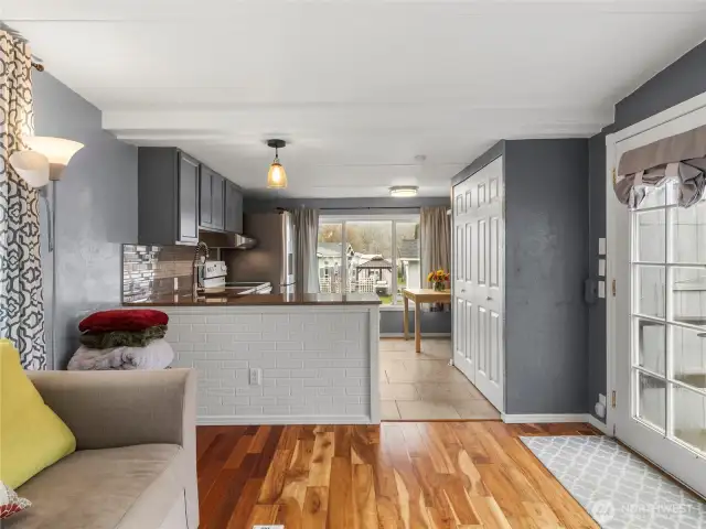 Open concept living with a french door entryway.