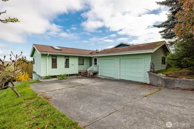 Home has large double garage with garage door openers