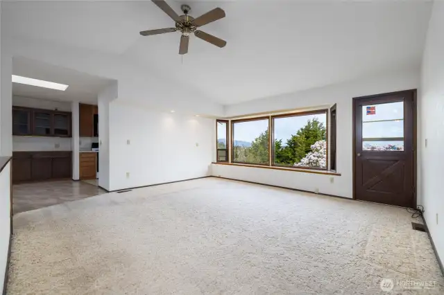 Living room with dining room to left