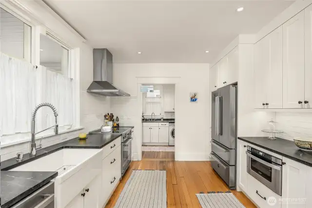 Another view of the kitchen with mudroom/laundry in the back.