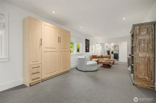 Lower level features a full bath and murphy bed.  There is also a huge storage room to the right.