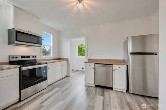 Updated kitchen with new flooring and updated stainless steel appliances