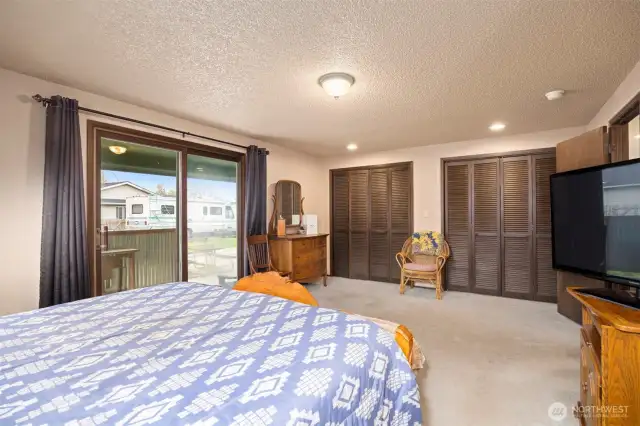 Main House:  Primary Suite offers large closets and entry to the outdoor patio