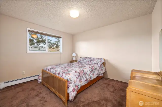 Main House:  Generous size guest bedroom with large closet
