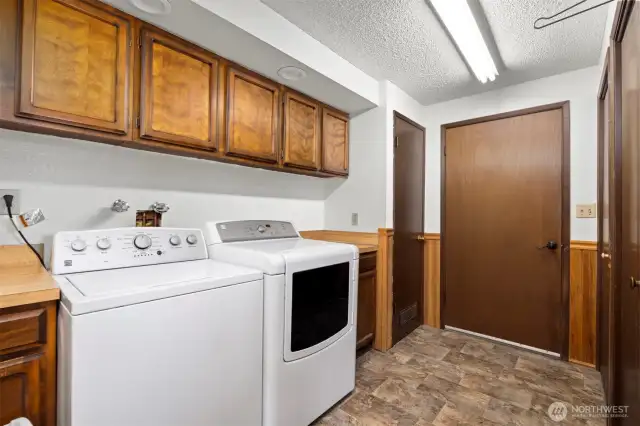 Main House: Laundry room with lots of storage located off of kitchen and offers entry via the garage