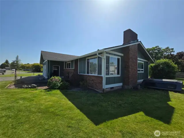 Exterior view of the The ADU (rented at $1300/mo, utilities included) has its own entrance, updated floors, fireplace & address—perfect for extra income or multi-gen living!