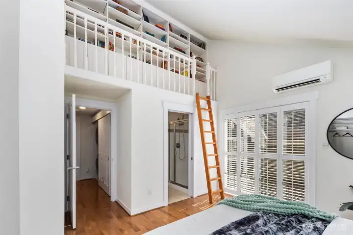 Surprise! The primary has a beautiful custom built bookshelf loft. Book lovers rejoice!