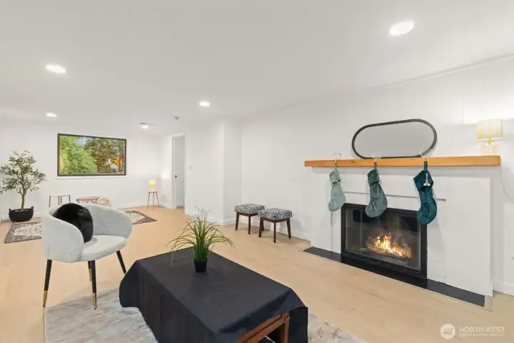 Basement level primary bedroom with freshly painted brick gas fireplace and solid oak wood mantle.